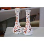 A pair of large late Victorian enamel painted opaque white glass vases, each of elongated flask