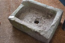 A rectangular weathered sandstone garden trough. 36cm by 50cm