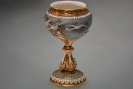 A Royal Worcester porcelain vase painted by Charles Baldwyn, characteristically decorated with swans