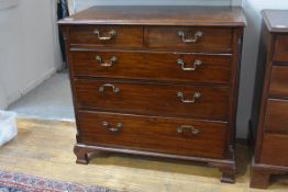 A George III mahogany chest of drawers, the rectangular moulded top above two short and three long