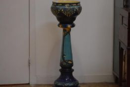 A Burmantofts Faience jardiniere on stand, c. 1900, moulded and painted in the Art Nouveau taste