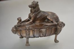A handsome patinated bronze inkstand, the cover modelled as a recumbent deerhound, late 19th