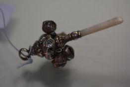 A small Edwardian silver rattle, Birmingham 1908, with mother of pearl handle and suspending four