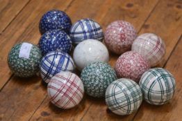 A group of twelve Scottish carpet bowls, second half of the 19th century, decorated in a variety