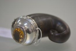 A late 19th century Scottish horn snuff mull, the hinged white metal cover set with a large oval