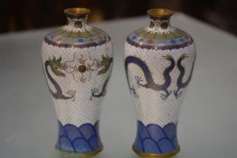 A pair of Japanese cloisonne vases, early 20th century, of slender baluster form, each decorated