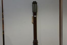 A George III mahogany stick barometer, early 19th century, the concave moulded crest over a bowed