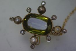 A diamond, seed pearl and coloured stone brooch, possibly a demantoid garnet, early 19th century,