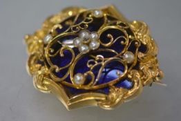 A striking Victorian diamond and seed pearl-set gold locket brooch, of shaped oval form, centred