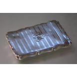 A 19th century silver-plated card case, with scalloped rim, engine turned bands and engraved with
