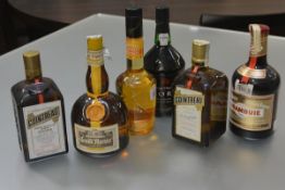 A group of liqueurs comprising: two bottles of Cointreau, 70cl; Grand Marnier Cordon Jaune, 70cl;