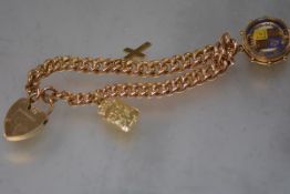 A 9ct gold charm bracelet, the curblink chain suspending a cased enamelled half sovereign, cross and