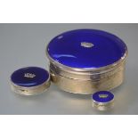 A matched set of three 1930's silver and blue enamel boxes, the largest, a jewellery box, of