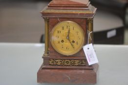 A gilt-brass mounted rouge marble mantel clock, late 19th century, of architectural form, the gilt