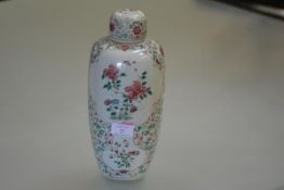 A Chinese porcelain jar and cover, of baluster form, with domed cover, painted in the famille rose