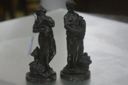 A pair of 19th century patinated bronze figures emblematic of Seasons, one carrying a wine jug the