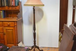 A mahogany columnar standard lamp, early 20th century, the fluted column with leaf and bellflower