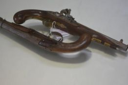 An early 19th century flintlock pistol, the lockplate signed Wheeler, with walnut stock (losses),