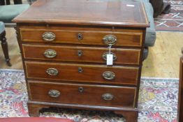 A small George III inlaid mahogany chest of drawers, the rectangular top with a band of satinwood