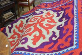 A Shyrdak (Kyrgyzstan) felted rug, in a characteristic pattern scrolling pattern, the central