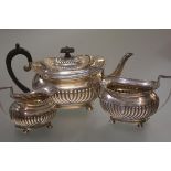 A late Victorian silver three piece tea service, Thomas Bradbury & Sons, London 1894, in the Regency