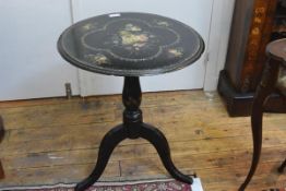 A Victorian painted and inlaid papier mache tilt-top tripod table, the circular top painted with