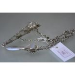A late 19th century silver-plated and cut-glass scent bottle chatelaine, modelled as a quiver of