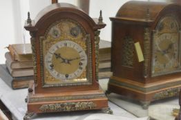 A late 19th century gilt-metal mounted oak bracket clock, the dome-top case enclosing a conforming