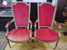 A pair of gilt-highlighted cream-painted fauteuils in 19th century style, each with curved arched