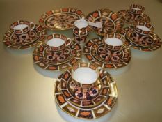 A Royal Crown Derby partial tea service, pattern no. 1128, comprising six teacups and saucers, six