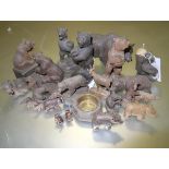 A group of Black Forest wooden bear and other animal models, including spill holders, pin cushion,