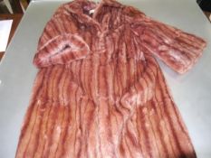 A vintage red fox fur lady's three-quarter length coat, with label for J. Jones