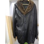 Hermes, a gentleman's black butter-soft leather three quarter length coat with Coypu fur collar,