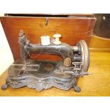 A late 19thc German cast iron sewing machine, Junker & Ruh, the base moulded with rococo scrolls