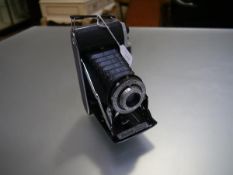 A Kodak Junior Dakon II shutter camera with 105mm Anaston G/6.3 lens mount 320 Kodak London