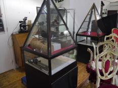 A pair of glazed Pyramid display cases. c. 183cm by 75cm square