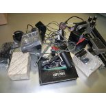 A collection of items for an Olympus OM system to include bellows, motor drive etc