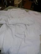 A group of vintage white damask table linens, two christening robes etc