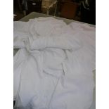 A group of vintage white damask table linens, two christening robes etc