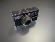 A Kodak Instamatic 500 with Schneider-Kreuznach 83622329 Xenar f:28/38mm lens