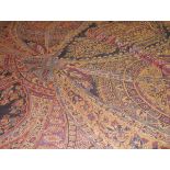 A large printed woollen shawl of Paisley type. c. 260cm by 240cm