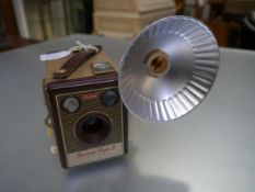 A Kodak Brownie flash b camera with flash holder