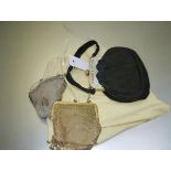 A gilt mesh lady's evening purse, early 20th century; together with a white metal mesh purse; and