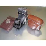 A mid-century Voigtlander Bessa folding camera in brown leather case, Voigtar Anastgmat lens 1:7.7