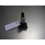 A striking blue topaz and diamond dress ring, mounted with a pair of pear-cut topaz amidst round