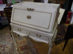 A 1950's/60's gilt-highlighted cream-painted bureau in the French taste. 104cm by 72cm by 50cm