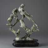 Early 20th Century white, black, and green Jade Carving of Tree and Birds with a carved wood stand