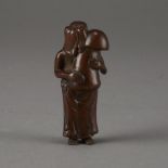 Japanese Edo Period Boxwood Netsuke of a Woman Holding a Large Mushroom