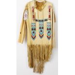 Two Native American Beaded and Fringed Leather Shirts