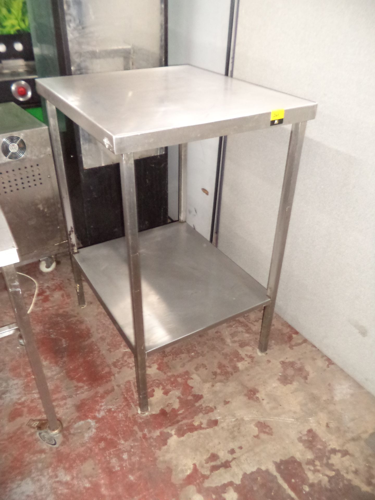 Tall stainless steel twin-tier table IMPORTANT: Please remember goods successfully bid upon must